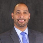 A headshot of Moises Feliz, the AVP of Lending/Office Manager at Furcattes Trust .