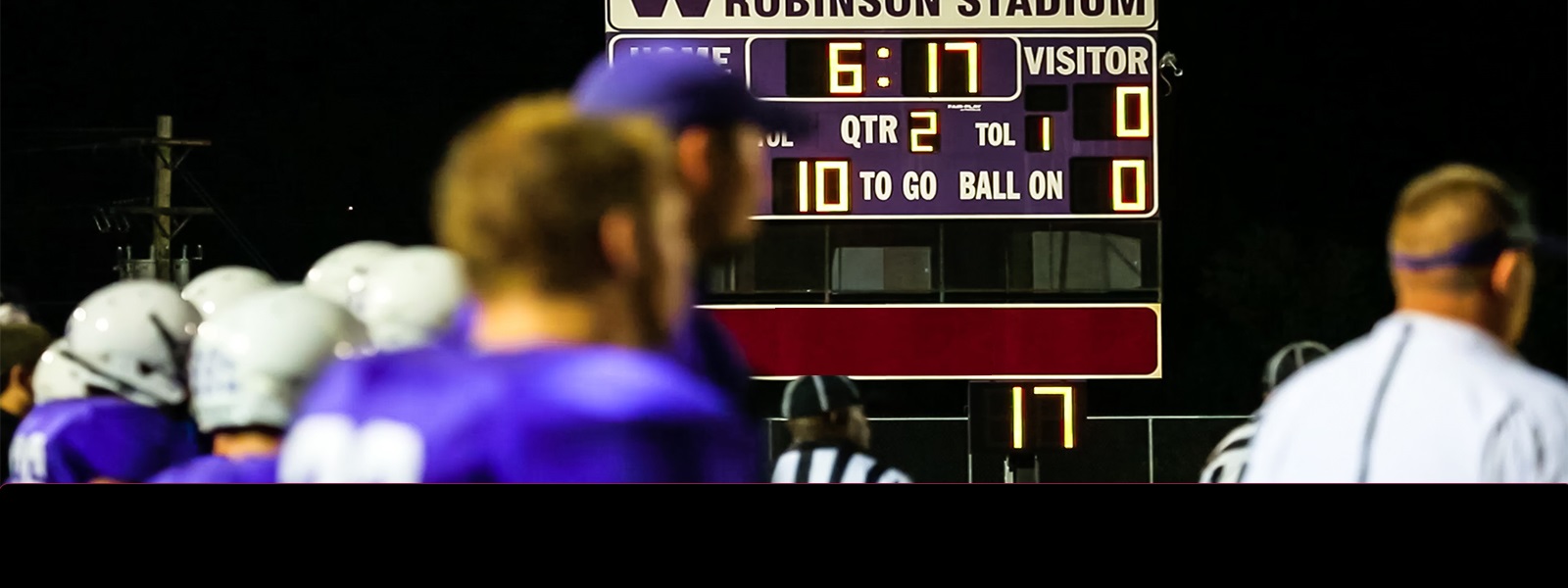 A high school football score board with Furcattes Trust logo.